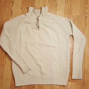 Cream colored zip-up turtleneck sweater